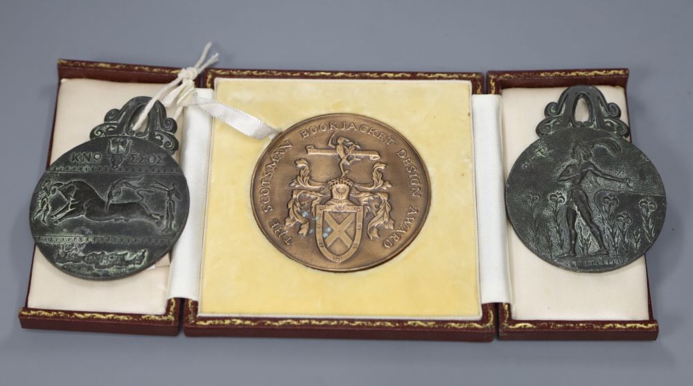 A cased medal for Book Jacket Design and two other medallions